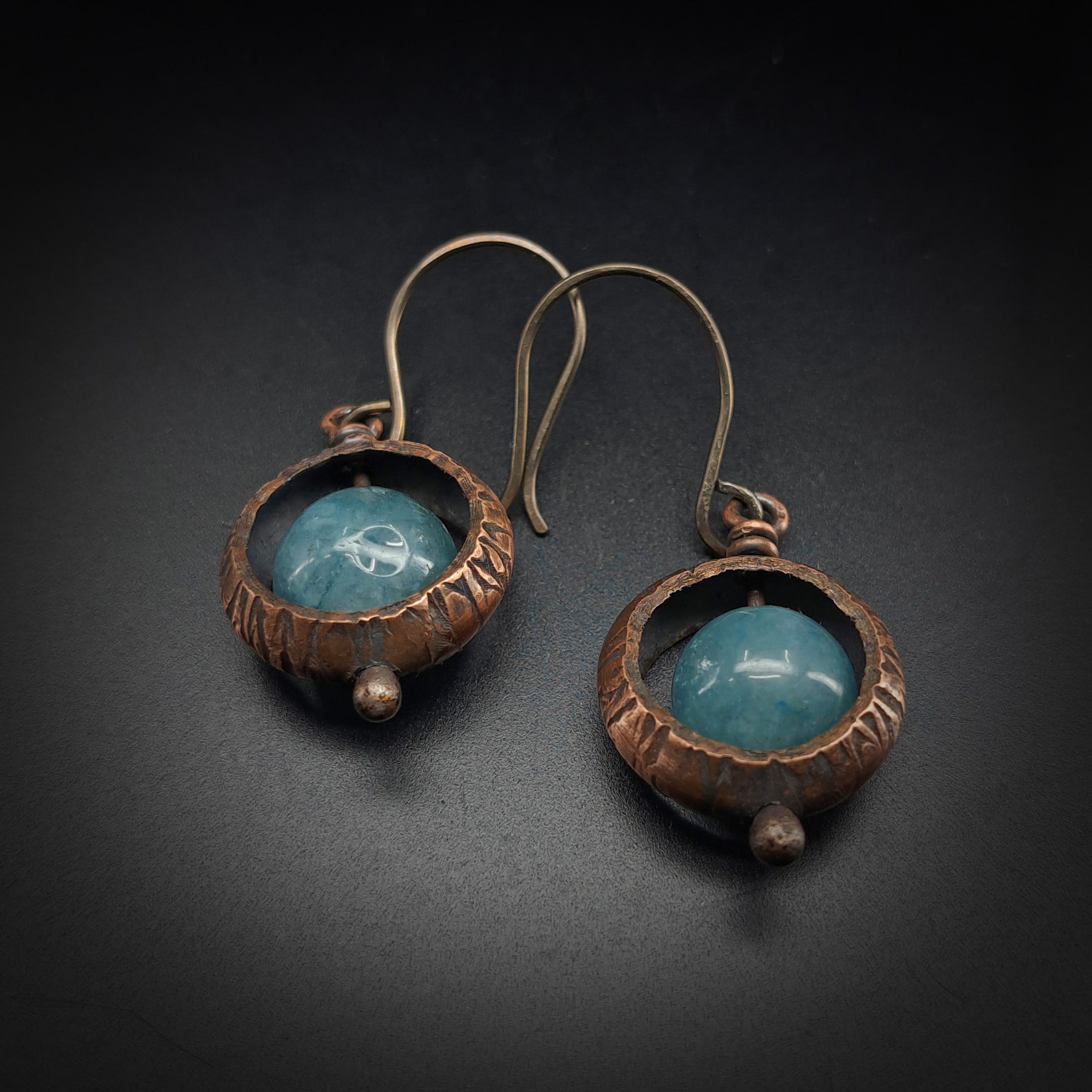 Copper ring earrings with aquamarine chalcedony flat lay, grey background — 1⅝ inch total length, handmade
