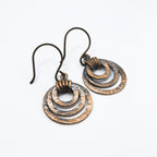 Small hammered copper ring earrings — triple hoop dangle, white background, handmade