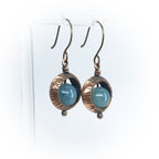 Copper ring earrings with aquamarine chalcedony on acrylic stand, white background — full view, ball drop detail