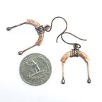 Copper arch earrings with quarter for size reference, white background — U-Turn
