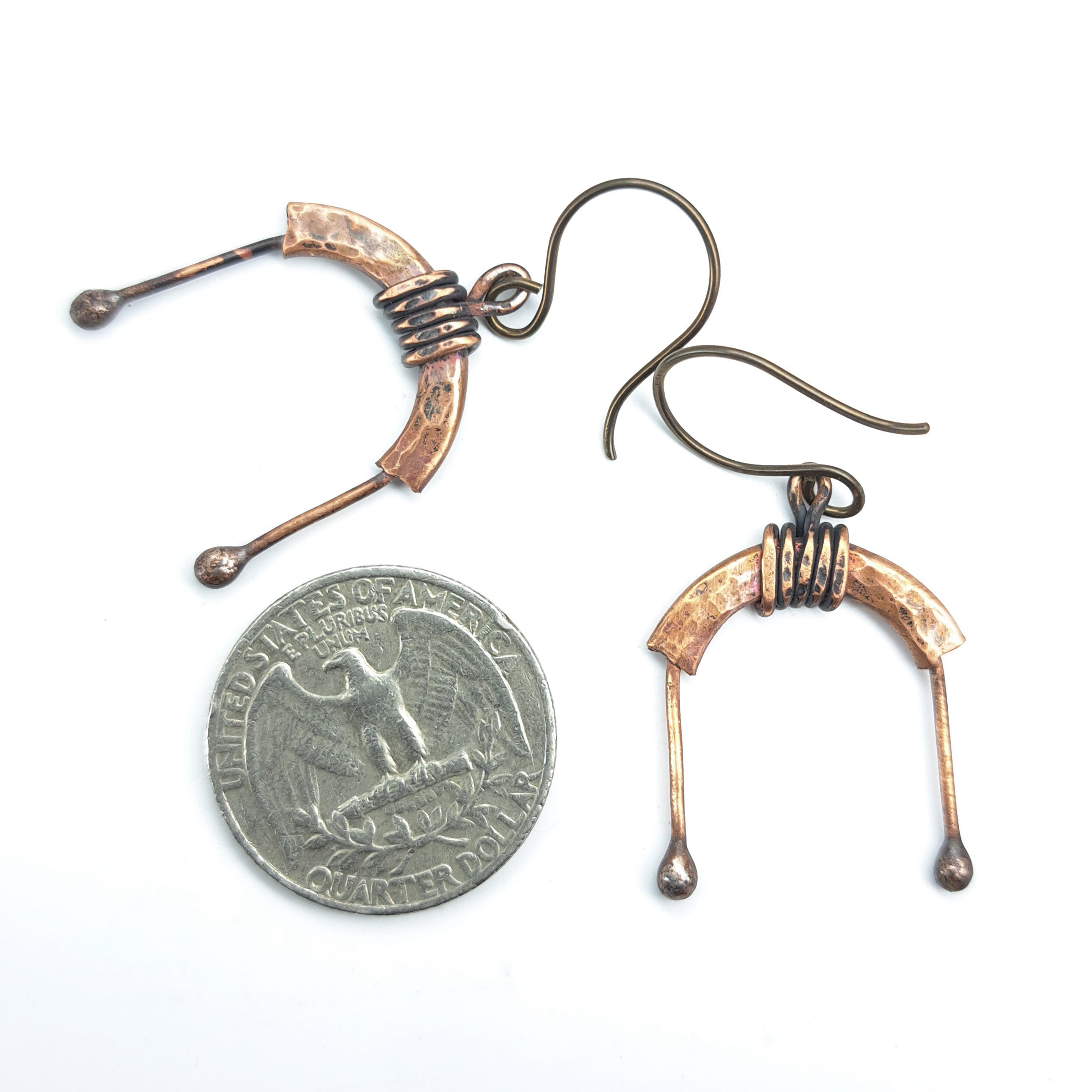 Copper arch earrings with quarter for size reference, white background — U-Turn