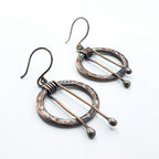 Hammered copper hoop earrings flat lay, white background — 1 inch diameter, 2 inch total length