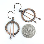 Hammered copper hoop earrings flat lay, white background — 1 inch diameter, 2 inch total length