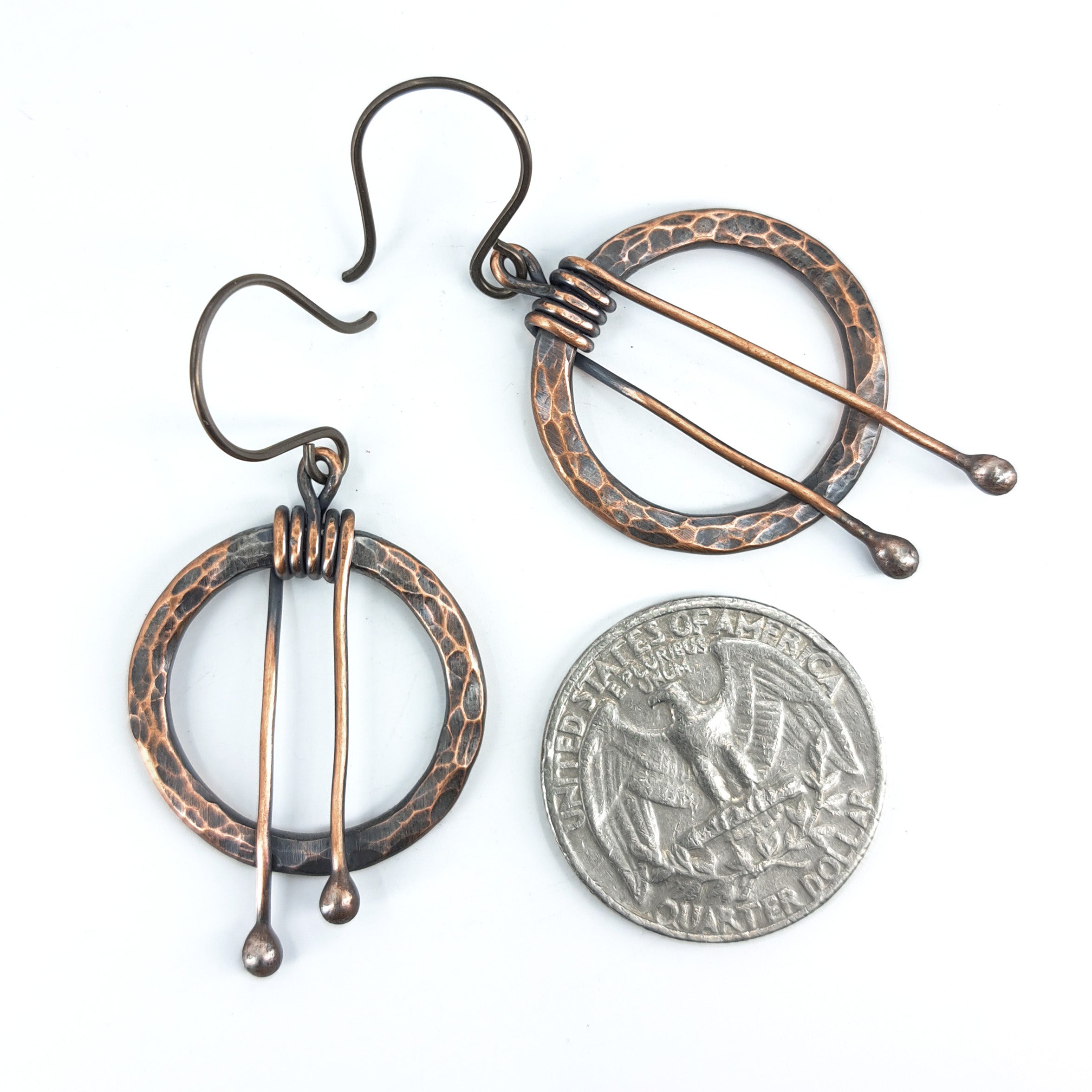 Hammered copper hoop earrings flat lay, white background — 1 inch diameter, 2 inch total length